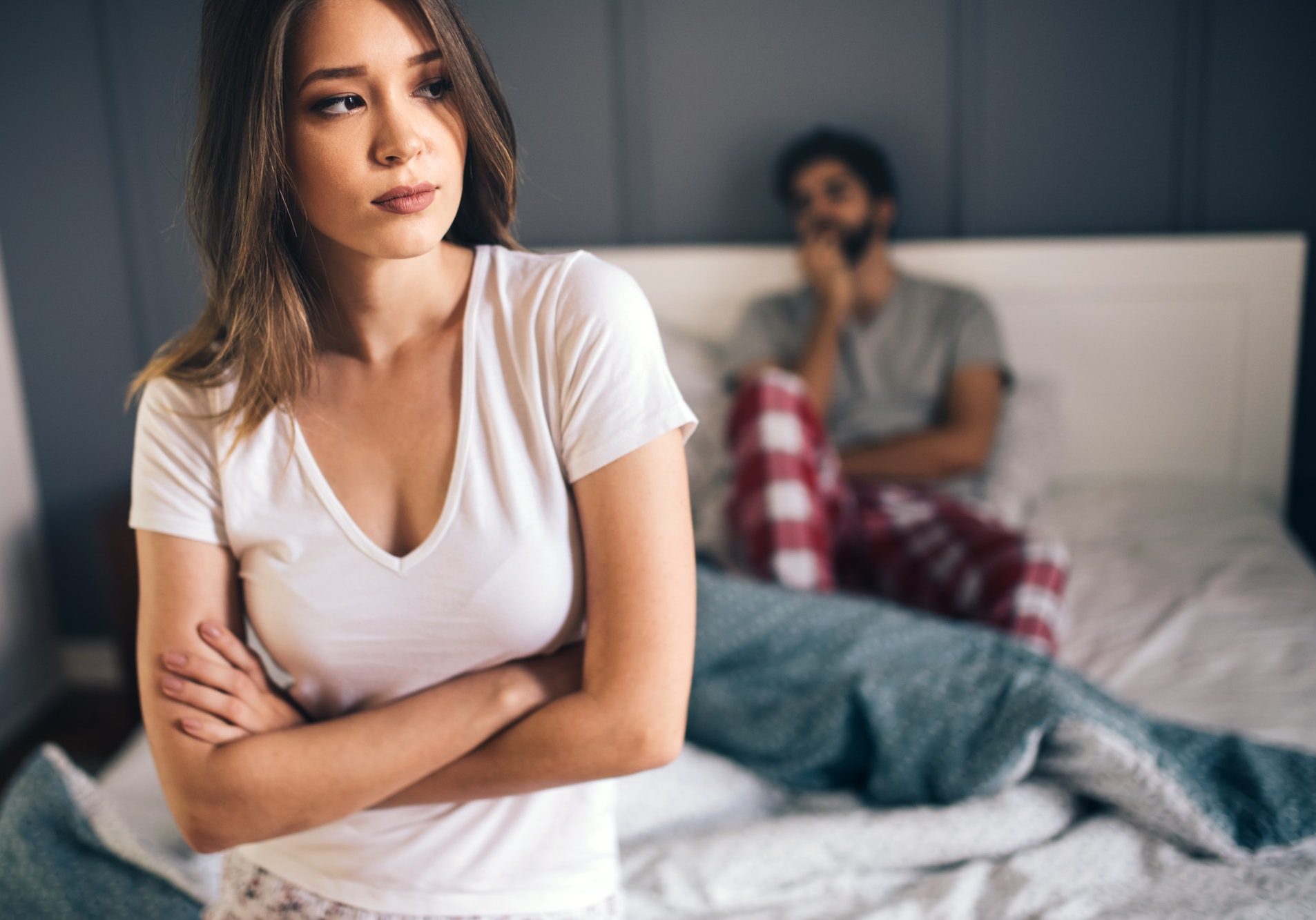 Couple having arguments and sexual problems in bed