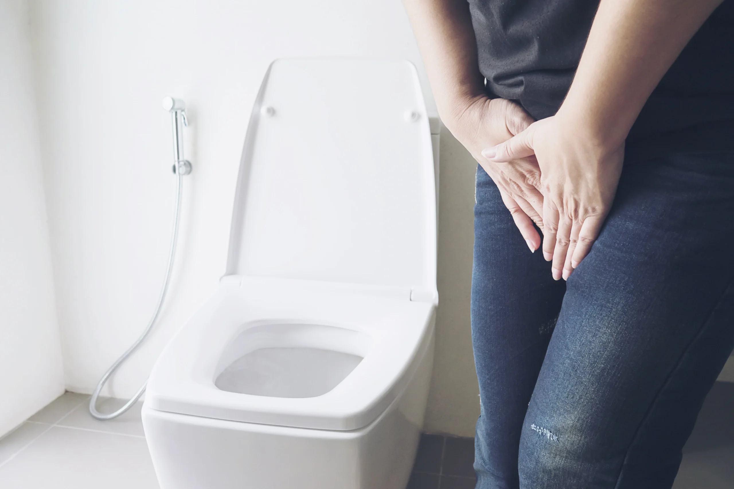 Woman Holding Hand Near Toilet Bowl Health Problem Concept understanding incontinence